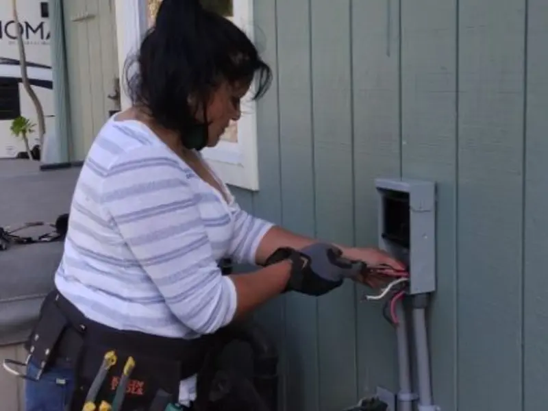 Licensed electrician wiring an exterior subpanel in Cresaptown
