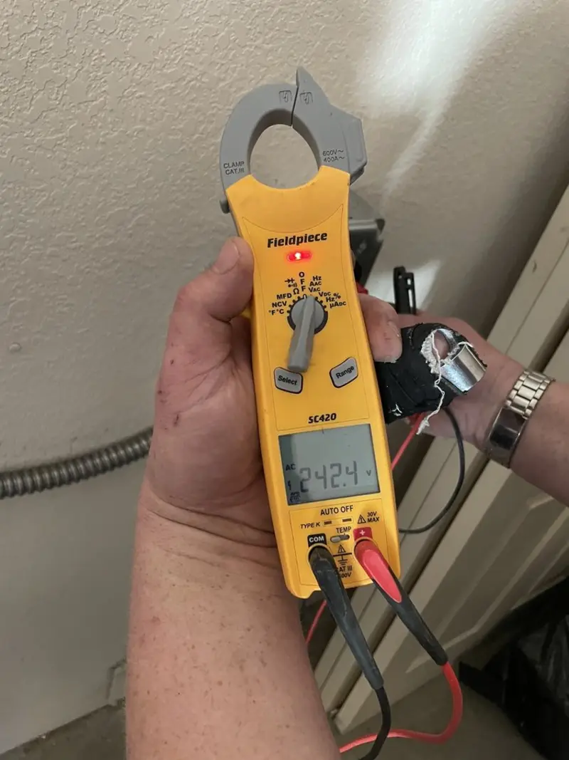 Voltage testing with clamp meter during Electrical Installation Services in Cresaptown